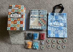 Azul board game with colorful ceramic-style tiles and a player scoring wall