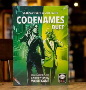 Codenames Duet word grid with agent cards laid out for two players